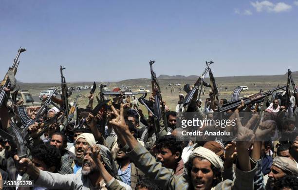 Shiite Houthis gather to protest Yemeni government and it's policies with kalashnikovs in Beit Na'am region 30 km far to Sanaa, Yemen on 20 August,...