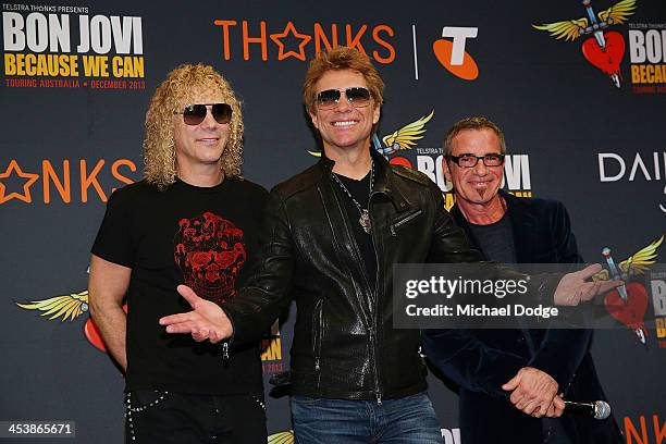 Bon Jovi members David Bryan Jon Bon Jovi and Tico Torres pose for the media at the Crown on December 6, 2013 in Melbourne, Australia.