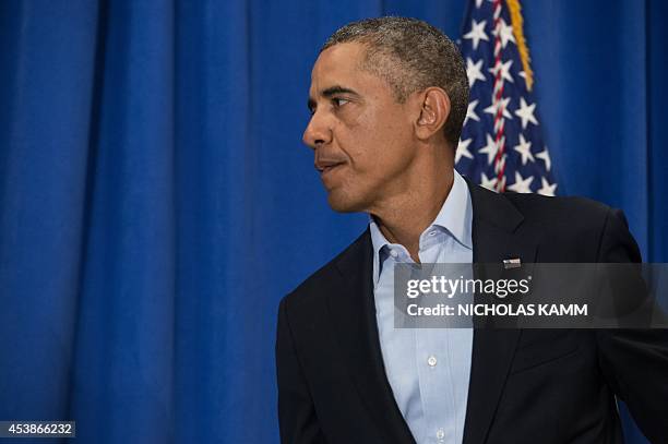 President Barack Obama leaves after making a statement to the press on the death of American journalist James Foley at Martha's Vineyard,...