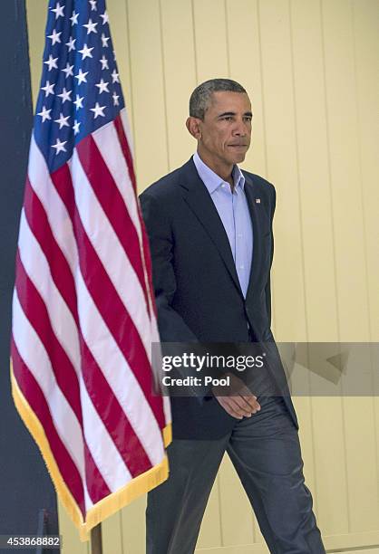 President Barack Obama arrives to make a statement about the execution of American journalist James Foley by ISIS terrorists in Iraq during a press...