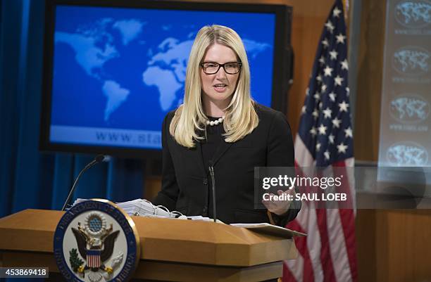 State Department Deputy Spokesperson Marie Harf speaks about the killing of American journalist James Foley by Islamic militants, as she holds the...