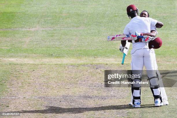 Darren Bravo of the West Indies celebrates scoring 200 runs with Darren Sammy during day four of the first test match between New Zealand and the...