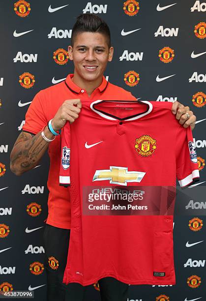Marcos Rojo of Manchester United poses after signing for the club at Aon Training Complex on August 20, 2014 in Manchester, England.