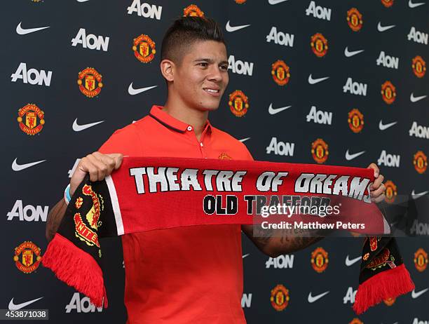 Marcos Rojo of Manchester United poses after signing for the club at Aon Training Complex on August 20, 2014 in Manchester, England.