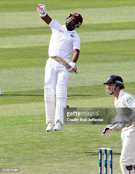 Darren Bravo of the West Indies punches the air in delight after scoring 200 runs during day four of the first test match between New Zealand and the...