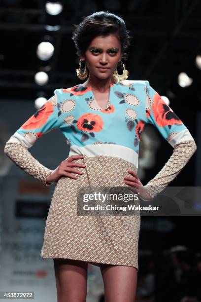 Model showcases designs by Masaba during the Opening Day show as part of Lakme Fashion Week Winter/Festive 2014 at The Palladium Hotel on August 19,...