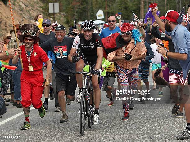 Jens Voigt of Germany riding for Trek Factory Racing is encouraged by fans on the climb to the finish during stage three of the 2014 USA Pro...