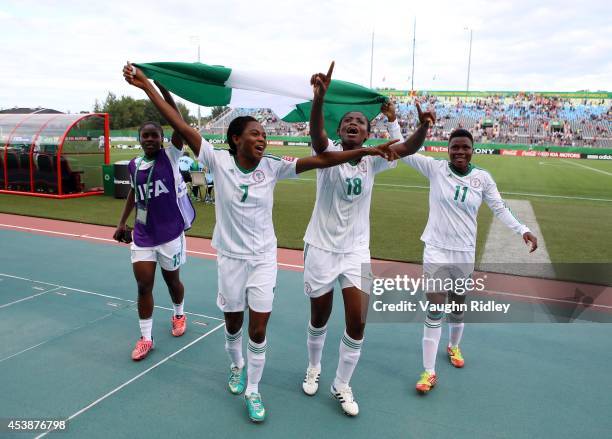 Yetunde Aluko, Loveth Ayila, Gladys Abasi and Yetunde Adeboyejo of Nigeria celebrate victory following the final whistle of the FIFA U-20 Women's...