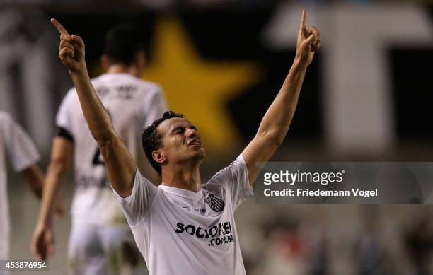 Leandro Damiao of Santos celebrates scoring the first goal during the match between Santos and Atletico PR for the Brazilian Series A 2014 at Vila...