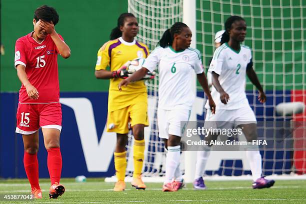 Jo Ryon Hwa of Korea DPR reacts during the FIFA U-20 Women's World Cup Canada 2014 Semi Final match between Korea DPR and Nigeria at Moncton Stadium...