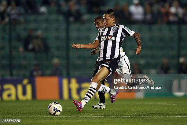 Junior Cesar of Botafogo battles for the ball with Giovanni Augusto of Figueirense during a match between Figueirense and Botafogo as part of...