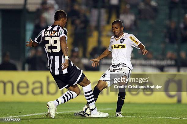Marcao of Figueirense fight for the ball with Junior Cesar of Botafogo during a match between Figueirense and Botafogo as part of Campeonato...