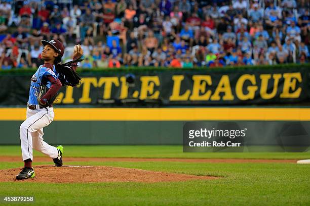 Mo'ne Davis of Pennsylvania pitches to a Nevada batter during the first inning of the United States division game at the Little League World Series...