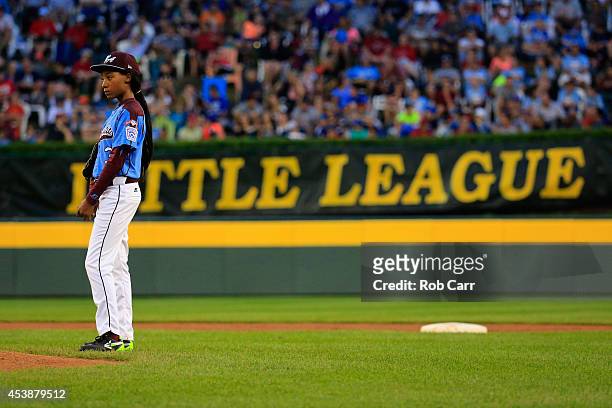 Mo'ne Davis of Pennsylvania looks on after giving up a run to Nevada during the first inning of the United States division game at the Little League...