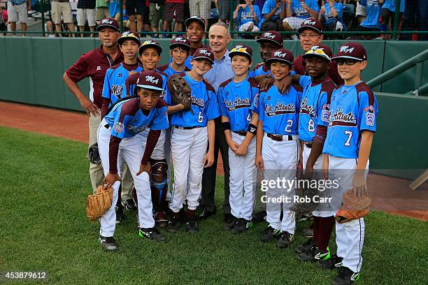 Major League Baseball COO and newly elected Commissioner of Major League Baseball Rob Manfred poses with members of the Pennsylvania team before the...