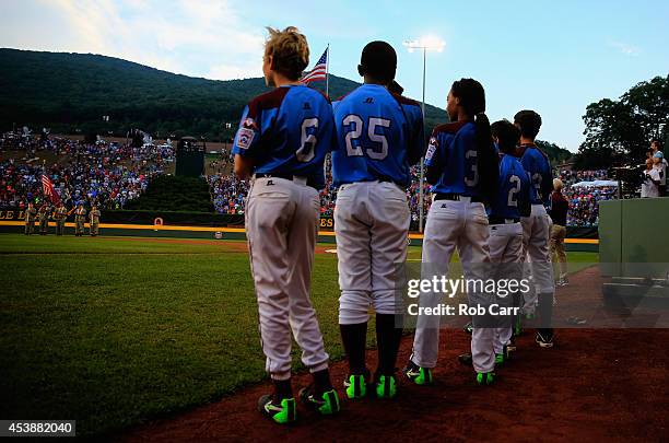 Members of the Pennsylvania team wait to take the field in the first inning against Nevada during their 8-1 loss during the United States division...