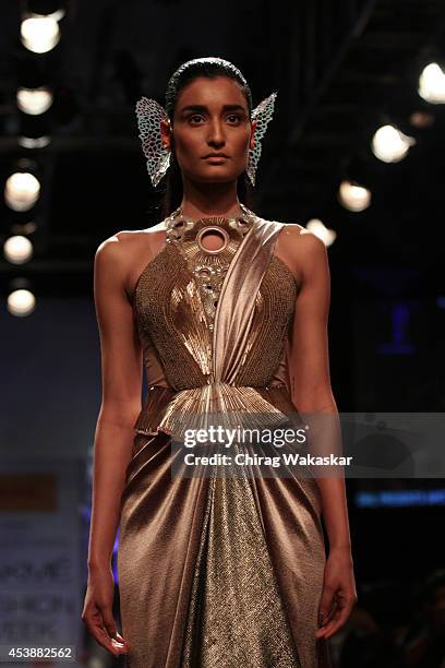 Model showcases designs by Amit Aggarwal during the Opening Day show as part of Lakme Fashion Week Winter/Festive 2014 at The Palladium Hotel on...