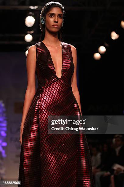 Model showcases designs by Amit Aggarwal during the Opening Day show as part of Lakme Fashion Week Winter/Festive 2014 at The Palladium Hotel on...