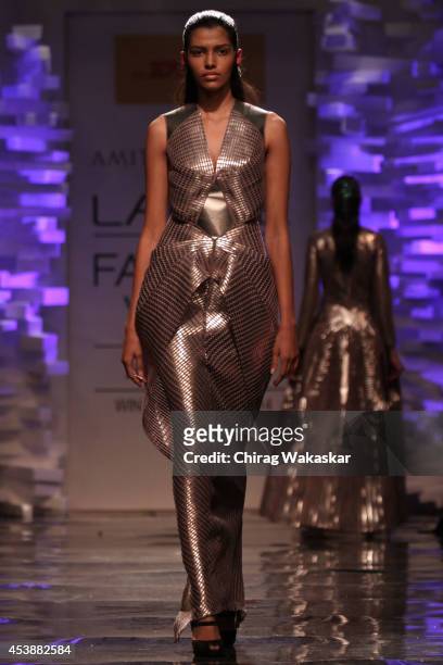 Model showcases designs by Amit Aggarwal during the Opening Day show as part of Lakme Fashion Week Winter/Festive 2014 at The Palladium Hotel on...
