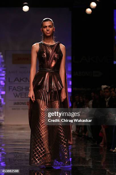 Model showcases designs by Amit Aggarwal during the Opening Day show as part of Lakme Fashion Week Winter/Festive 2014 at The Palladium Hotel on...