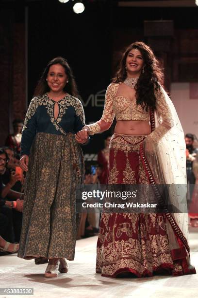 Jacqueline Fernandez walks the runway with Anju Modi during day 1 of Lakme Fashion Week Winter/Festive 2014 at The Palladium Hotel on August 20, 2014...