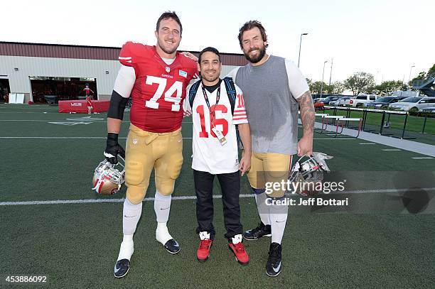 Fighter Danny Castillo poses with San Francisco 49ers offensive tackles Joe Staley and Adam Snyder at the SAP Performance Facility at Levi's Stadium...