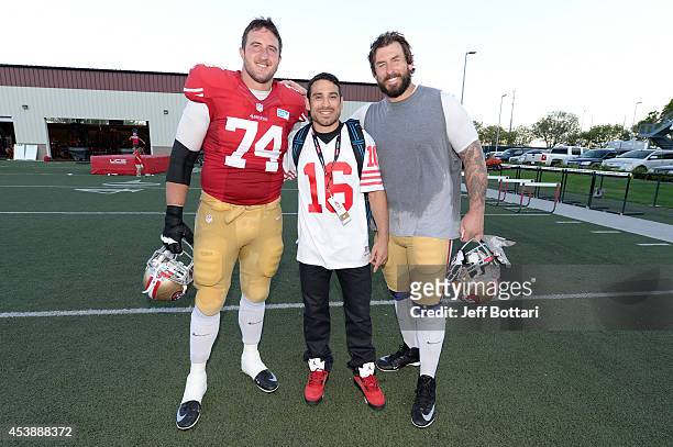 Fighter Danny Castillo poses with San Francisco 49ers offensive tackles Joe Staley and Adam Snyder at the SAP Performance Facility at Levi's Stadium...