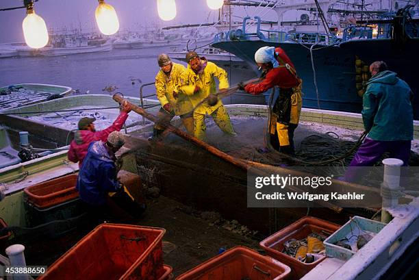 Japan, Hokkaido Island, Shiretoko Peninsula, Rausu, Harbor, Fishing Boat, Fishermen Working.