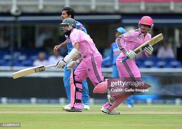 Hashim Amla and Quinton de Kock run a single during the 1st Momentum ODI match between South Africa and India at Bidvest Wanderers Stadium on...