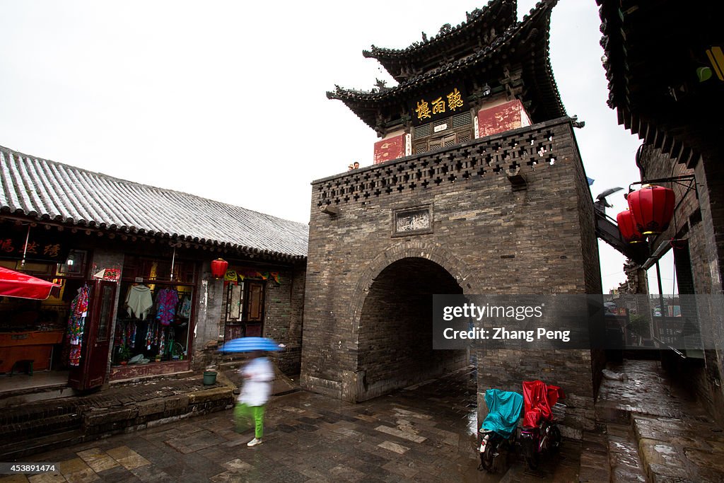 Ancient city gate and architecture on a rainy day,  Pingyao...