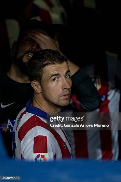 Captain Gabi Fernandez of Atletico de Madrid looks to the pitch ahead his teammate goalkeeper Miguel Angel Moya from the changing rooms tunnel prior...
