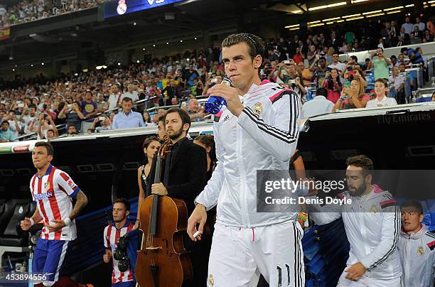 Gareth Bale of Real Madrid takes to the field for the start of the Supercopa first leg match between Real Madrid and Club Atletico de Madrid at...