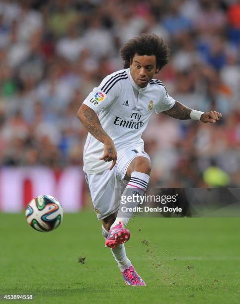 Marcelo of Real Madrid in action during the Supercopa first leg match between Real Madrid and Club Atletico de Madrid at Estadio Santiago Bernabeu on...