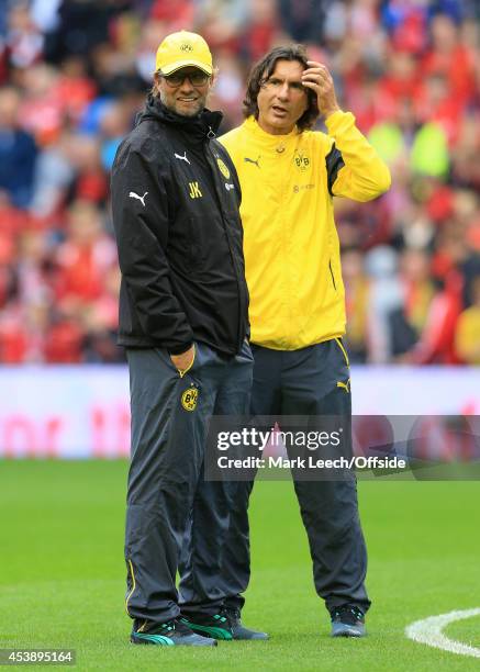 Dortmund coach Jurgen Klopp and assistant Zeljko Buvac look on during the warm-up before the pre-season friendly match between Liverpool and Borussia...