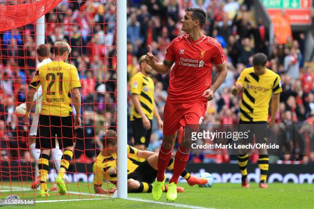 Dejan Lovren of Liverpool celebrates after scoring their 2nd goal during the pre-season friendly match between Liverpool and Borussia Dortmund at...