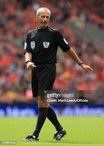 Referee Martin Atkinson looks on during the pre-season friendly match between Liverpool and Borussia Dortmund at Anfield on August 10, 2014 in...