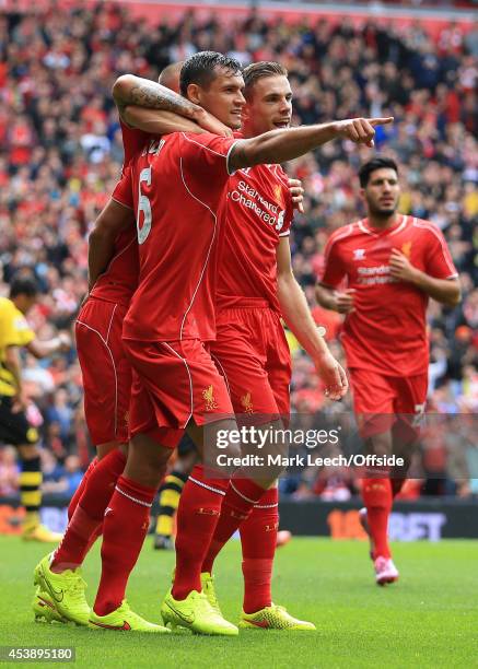 Dejan Lovren of Liverpool celebrates with teammate Jordan Henderson after scoring their 2nd goal during the pre-season friendly match between...