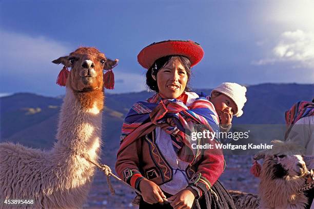 Peru, Near Cuzco, Quechua Woman With Llama In Evening Light.