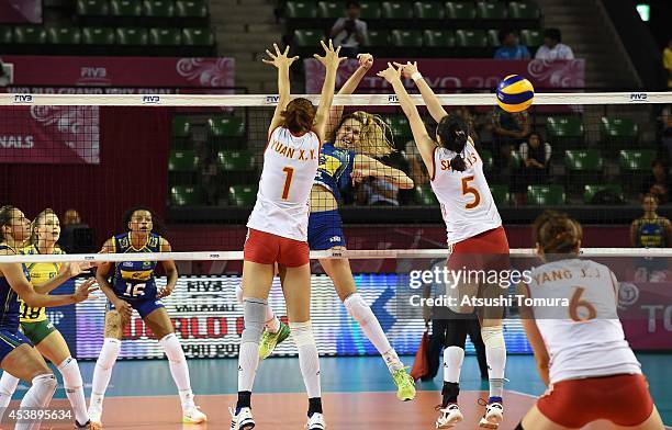 Thaisa Menezes of Brazil spikes the ball against China during the FIVB World Grand Prix Final group one match between Brazil and China on August 21,...