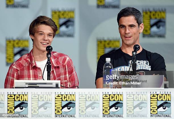 Actors Colin Ford and Eddie Cahill attend the "Under the Dome" panel during Comic-Con International 2014 at the San Diego Convention Center on July...