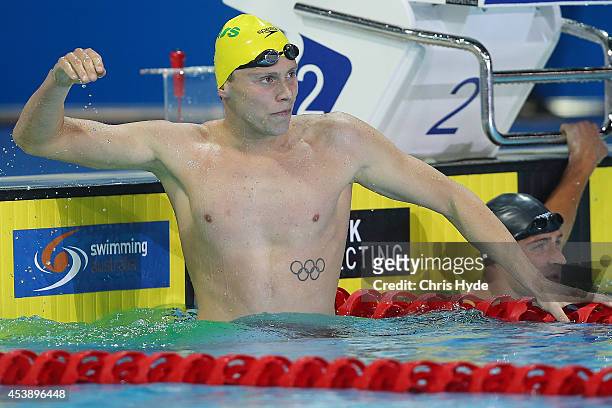 Thomas Fraser-Holmes of Australia celebrates winning the Men's 200m Freestyle final during day one of the 2014 Pan Pacific Championships at Gold...