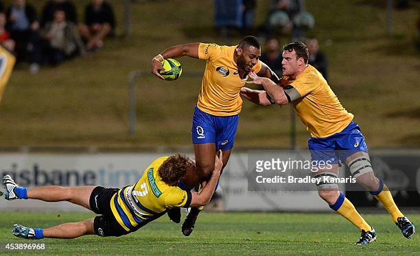 Samu Kerevi of Brisbane attempts to break free from the defence during the round one National Rugby Championship match between Brisbane City and...