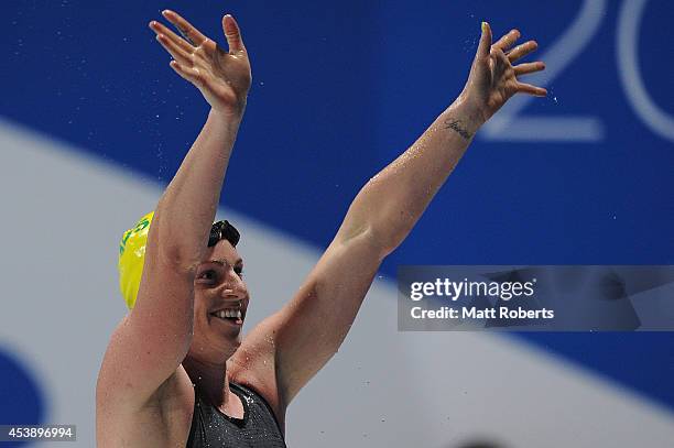 Emily Seebohm of Australia celebrates winning the Women's 100m Backstroke final during day one of the 2014 Pan Pacific Championships at Gold Coast...