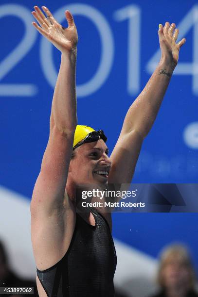 Emily Seebohm of Australia celebrates winning the Women's 100m Backstroke final during day one of the 2014 Pan Pacific Championships at Gold Coast...