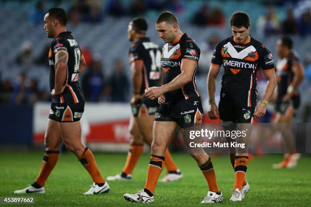 Robbie Farah of the Tigers looks dejected during the round 24 NRL match between the Canterbury Bulldogs and the Wests Tigers at ANZ Stadium on August...