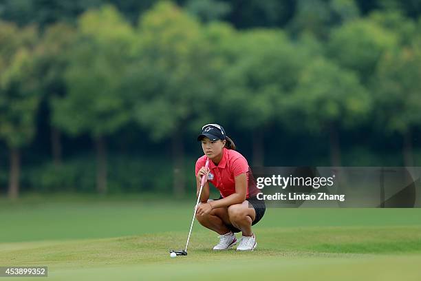 Ssu-Chia Cheng of Chinese Taipei lines up a putt during the Women's Individual Stroke Play on day five of the Nanjing 2014 Summer Youth Olympic Games...