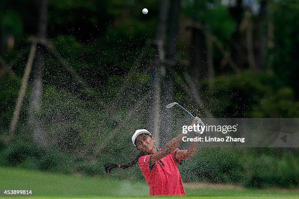 Aditi Ashok of India plays a shot during the Women's Individual Stroke Play on day five of the Nanjing 2014 Summer Youth Olympic Games at Zhongshan...