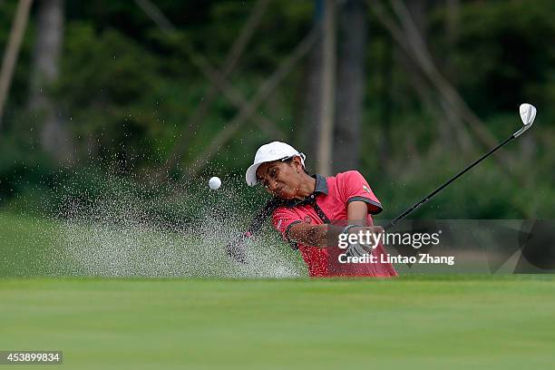 Aditi Ashok of India plays a shot during the Women's Individual Stroke Play on day five of the Nanjing 2014 Summer Youth Olympic Games at Zhongshan...