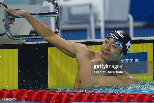 Ryosuke Irie of Japan celebrates winning the Men's 100m Backstroke final during day one of the 2014 Pan Pacific Championships at Gold Coast Aquatics...