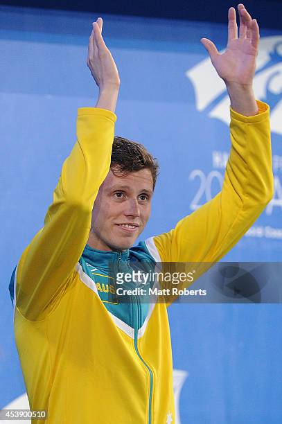 Thomas Fraser-Holmes of Australia acknowledges the crowd after winning the Men's 200m Freestyle final during day one of the 2014 Pan Pacific...